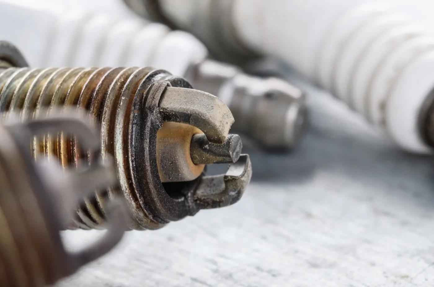 Close-up of an old used spark plug from an internal combustion engine