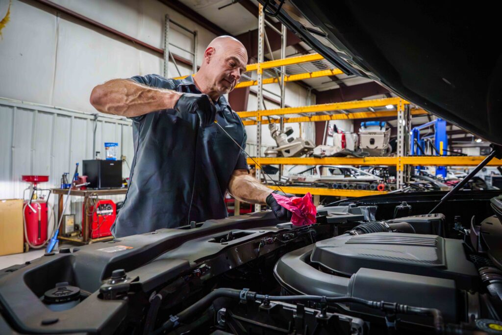 David Sluder at Titan Auto Services Changing Oil
